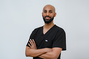 Photo of Dr Shehab Abdalla wearing a black scrub